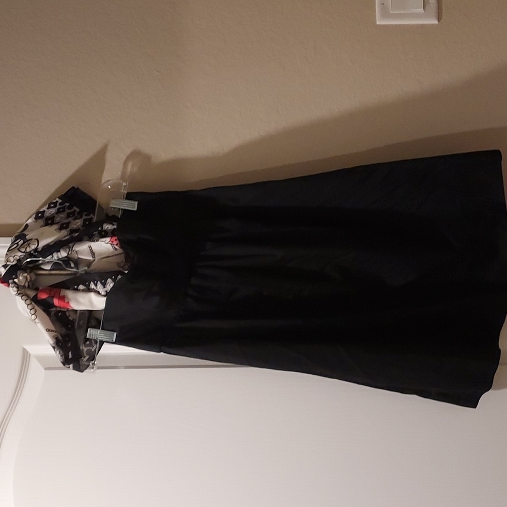 Black dress Ivanka Trump with a scarf tie on top